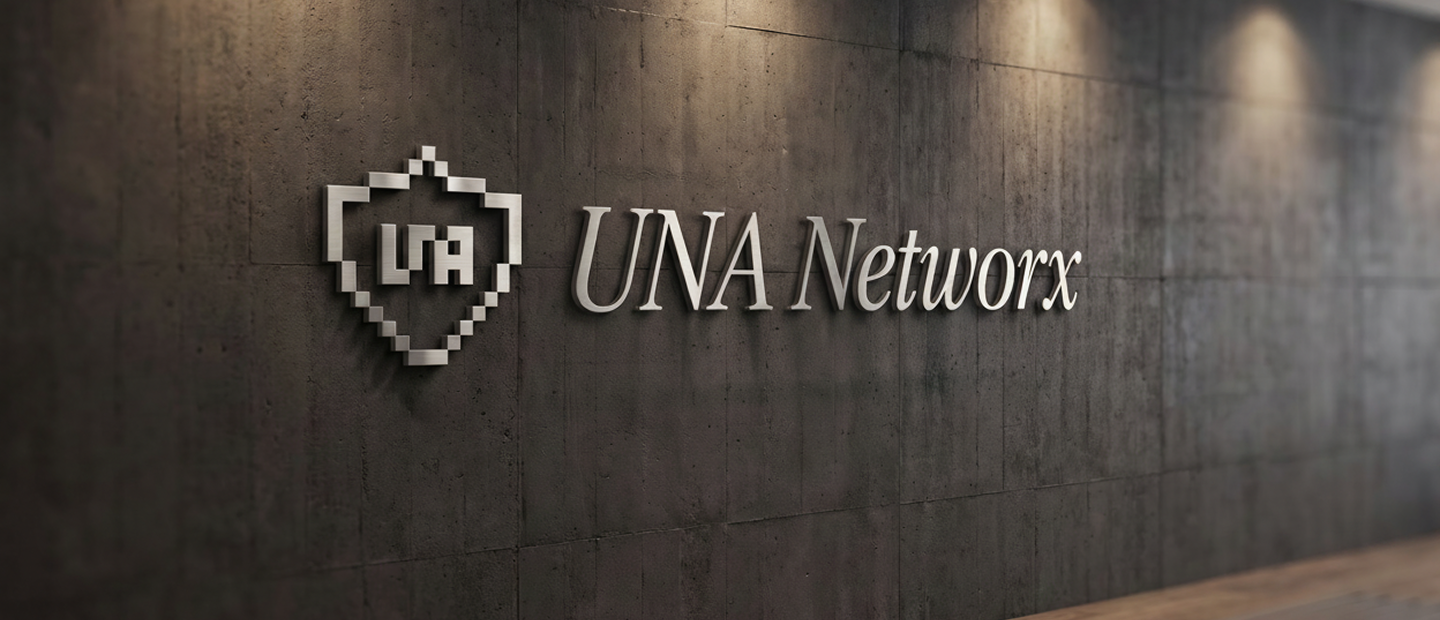 Brushed-steel UNA Networx sign on a concrete reception wall
